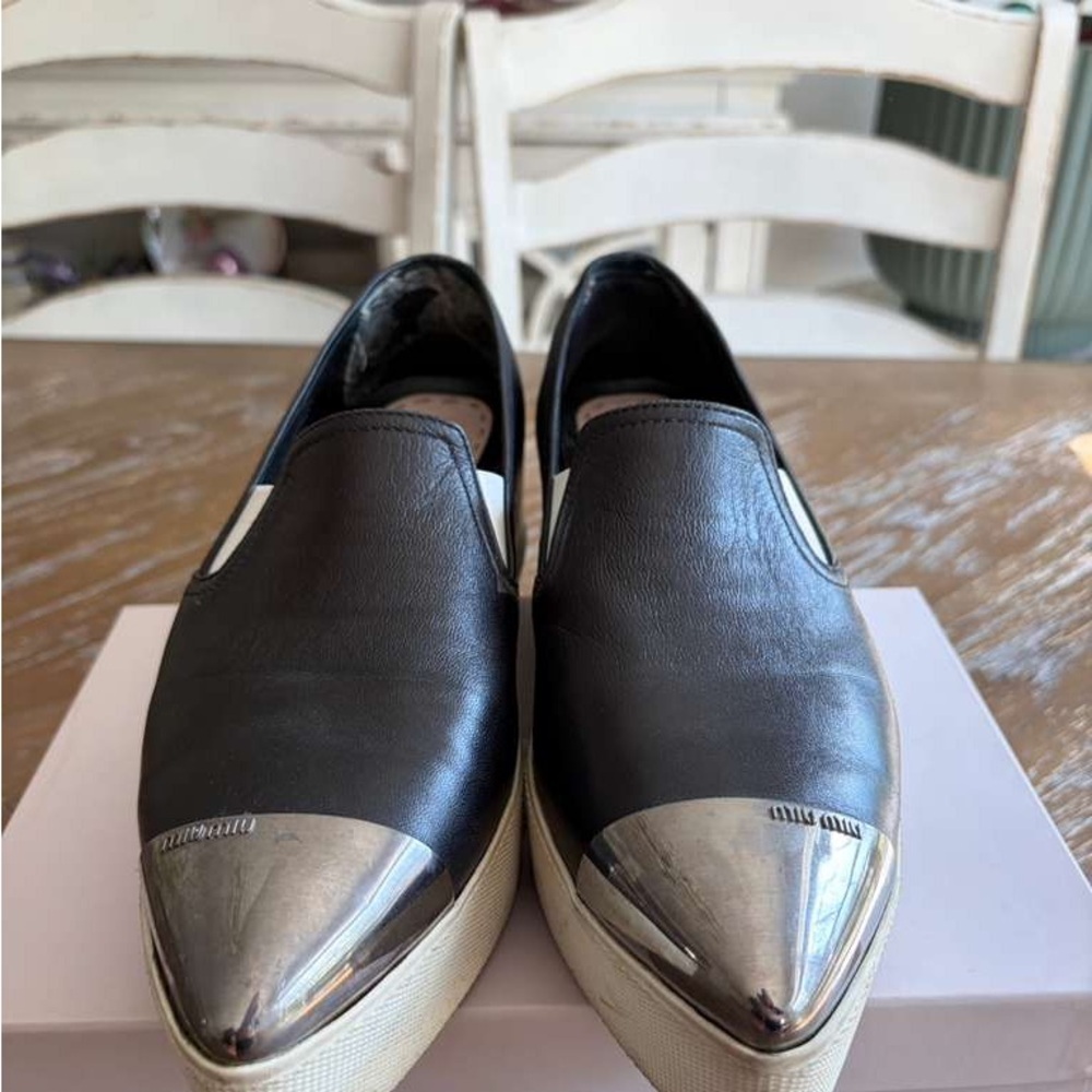 Miu Miu Black Leather Slip-Ons with Metallic Silver Toe